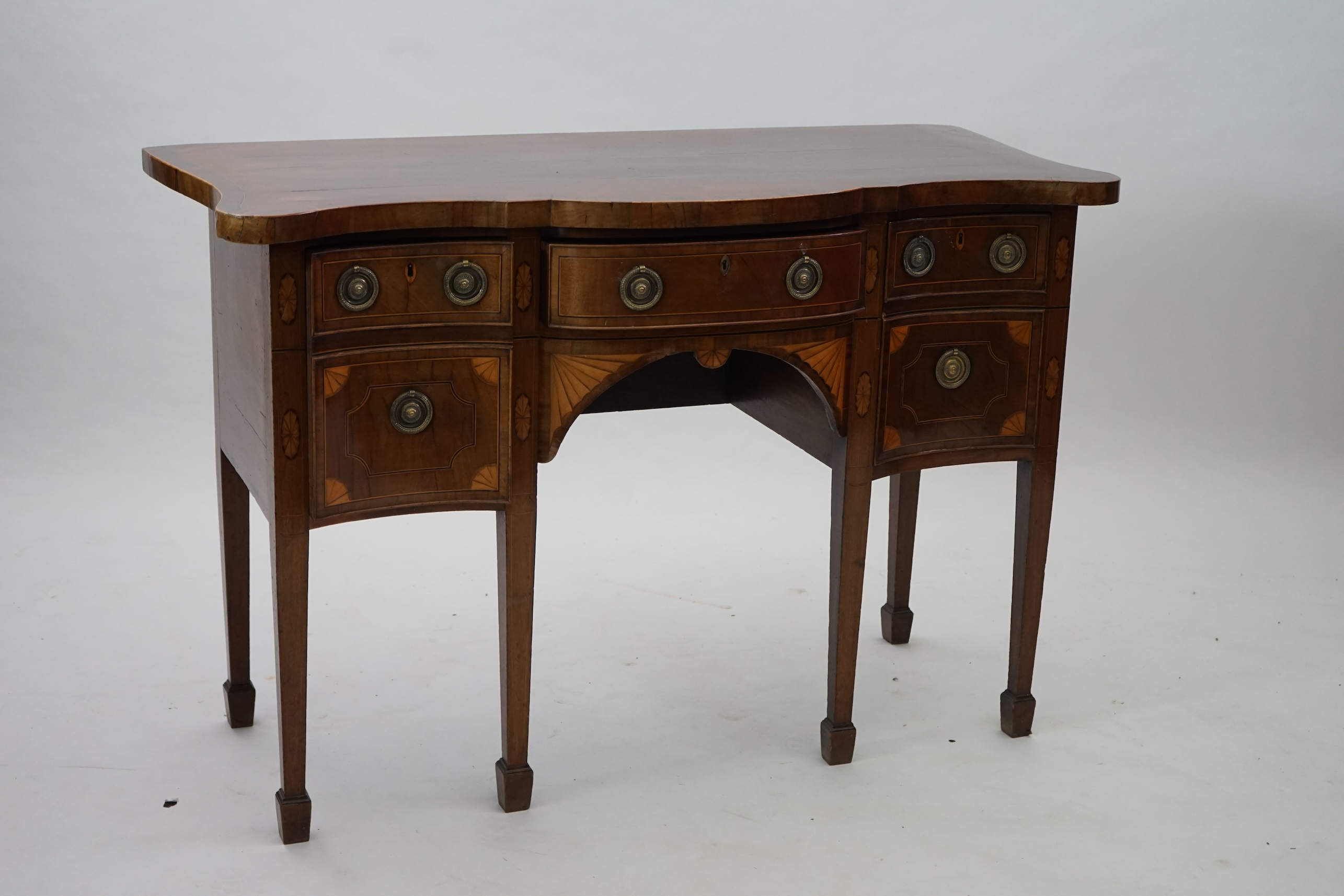 A George III inlaid mahogany serpentine sideboard